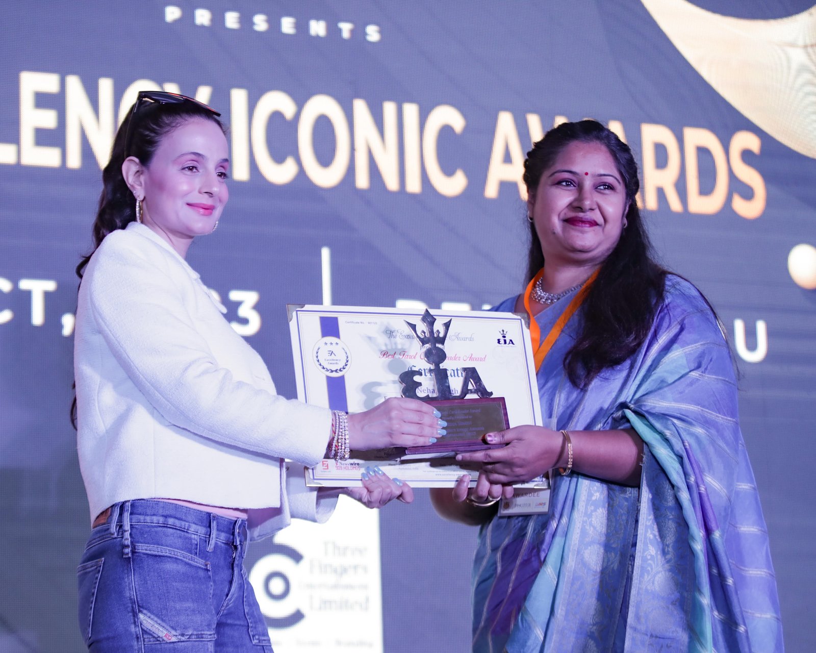 Neha receiving an Excellency Iconic Award