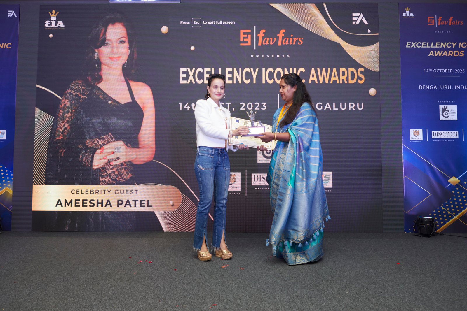 Neha receiving an award at the Excellency Iconic Awards 2023